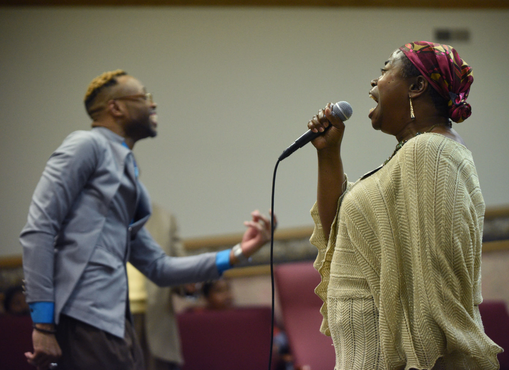Assistant Pastor Lamont Walker, left, and his mother, Renee Lewis, sing